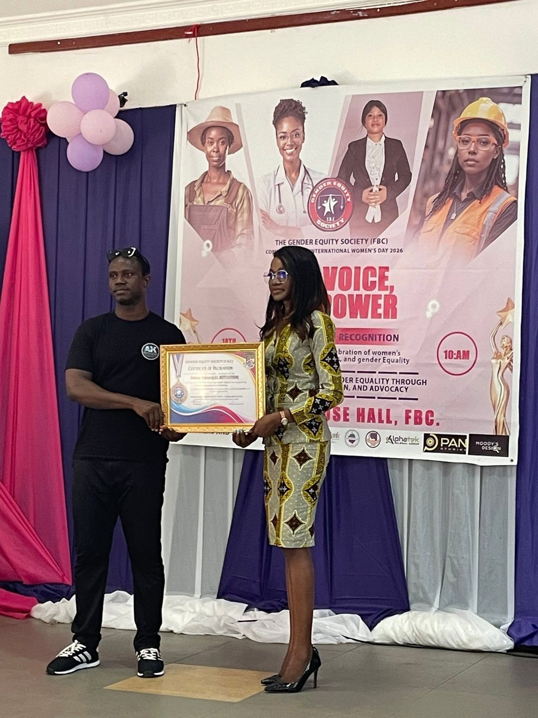 Abdulai receiving a Certificate of Recognition from the Gender Equity Society at Fourah Bay College