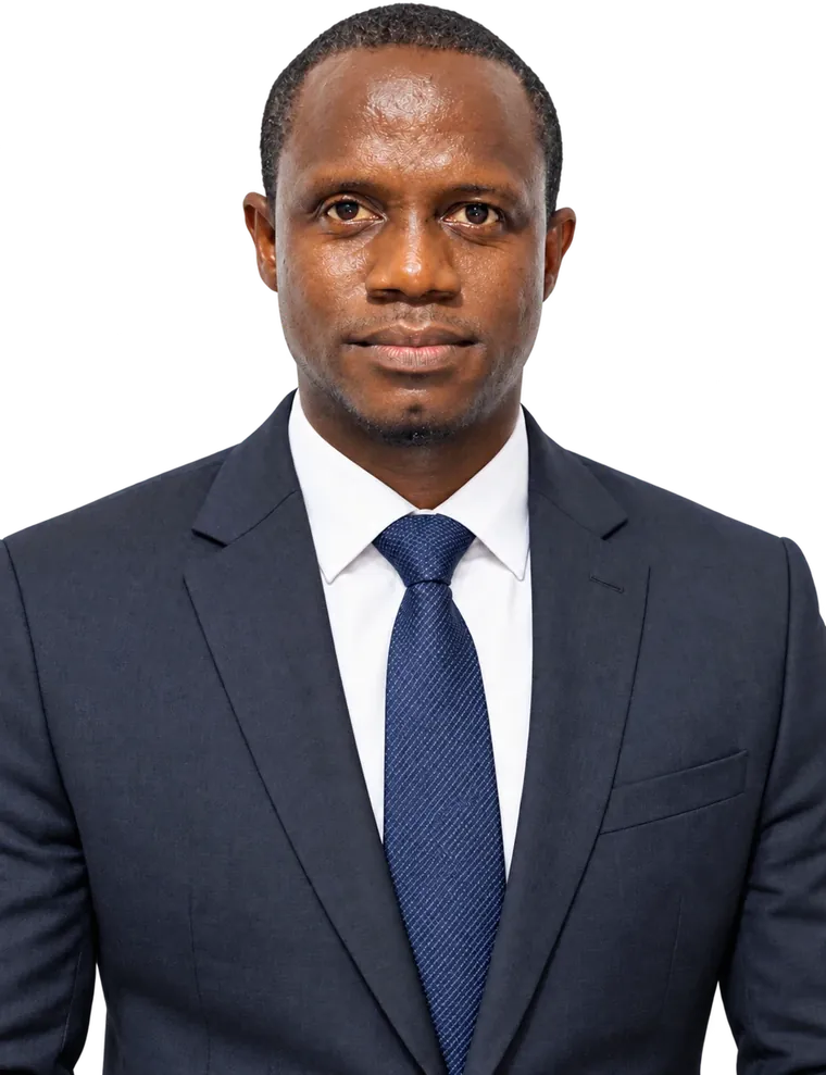 Abdulai Kamara in a navy suit and blue tie