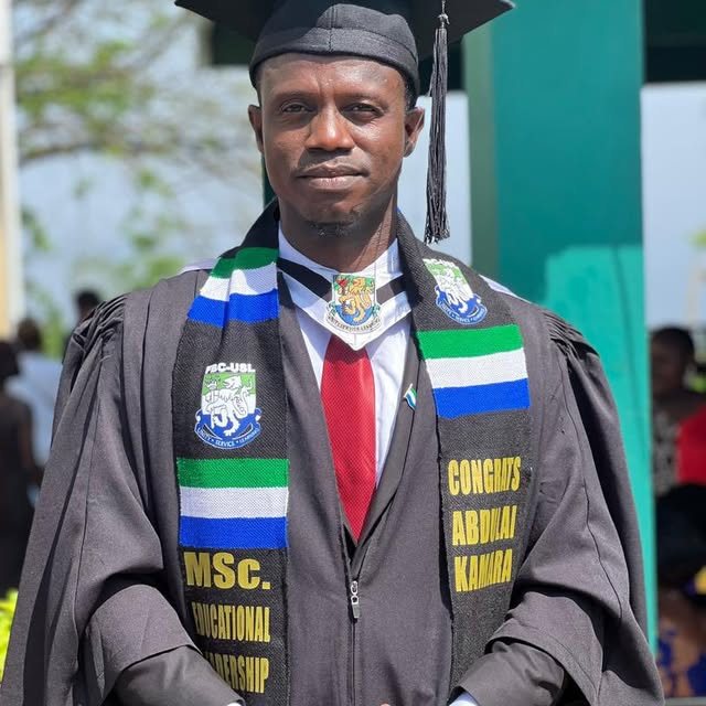 Abdulai Kamara at his MSc graduation from Fourah Bay College, wearing a Sierra Leone flag stole