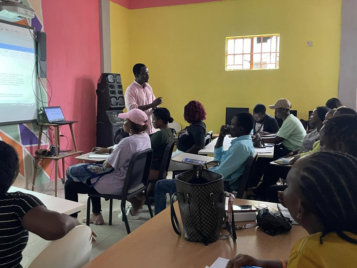 Abdulai leading a classroom workshop with young adults